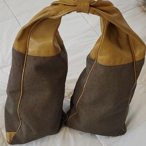 Yves Saint Laurent Top Knot Double Sided Shoulder Bag. 24" X 10" X1 0" (Triangle